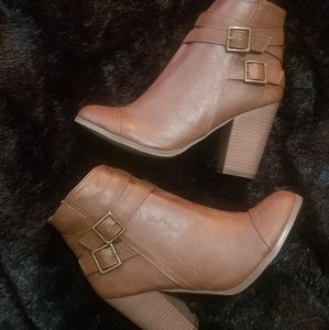 Brown heeled booties.